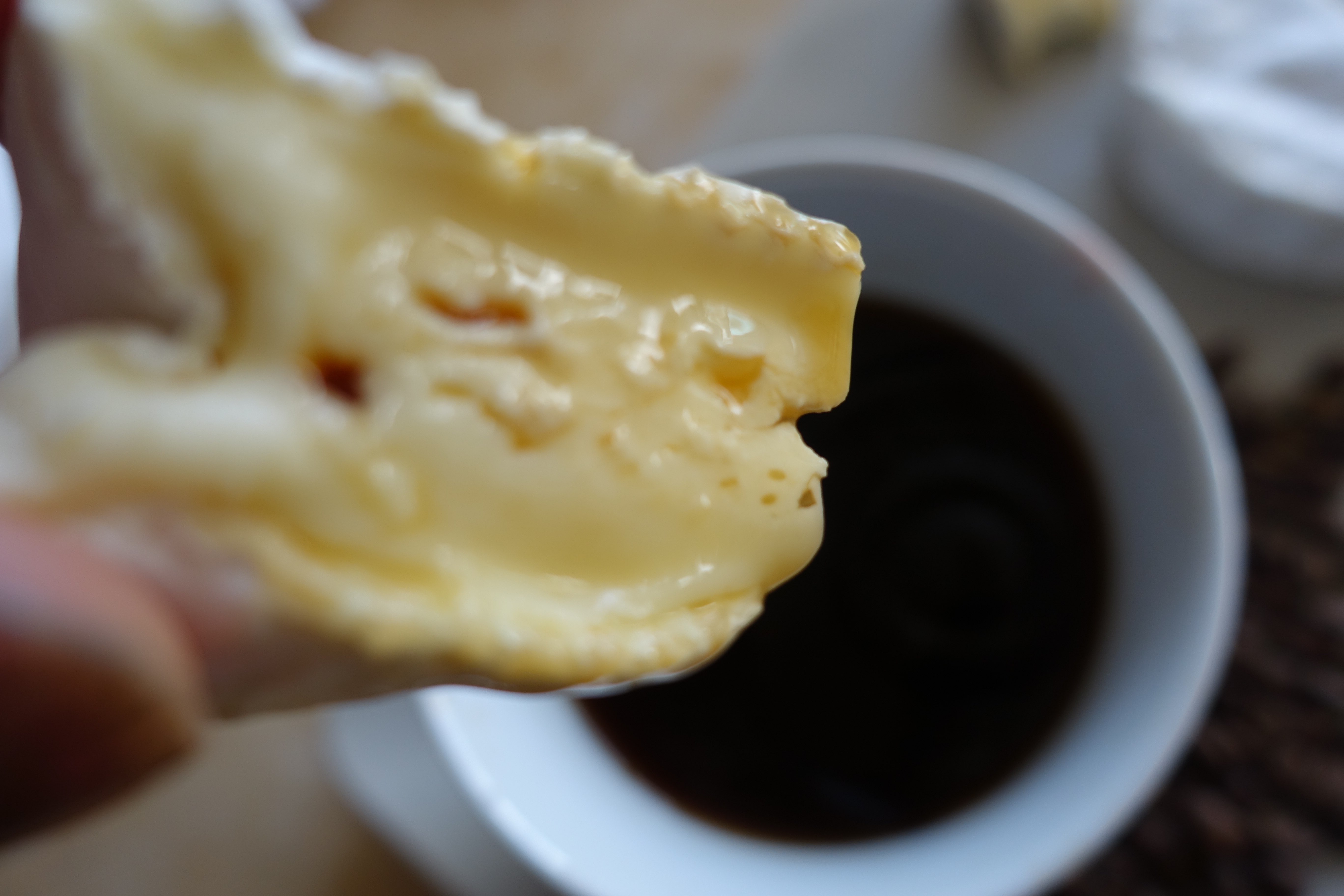Cheese dunked in coffee.
